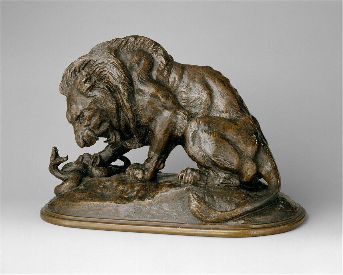 Antoine-Louis Barye bronze of a lion confronting a serpent, warm brown patina, modelled 1832