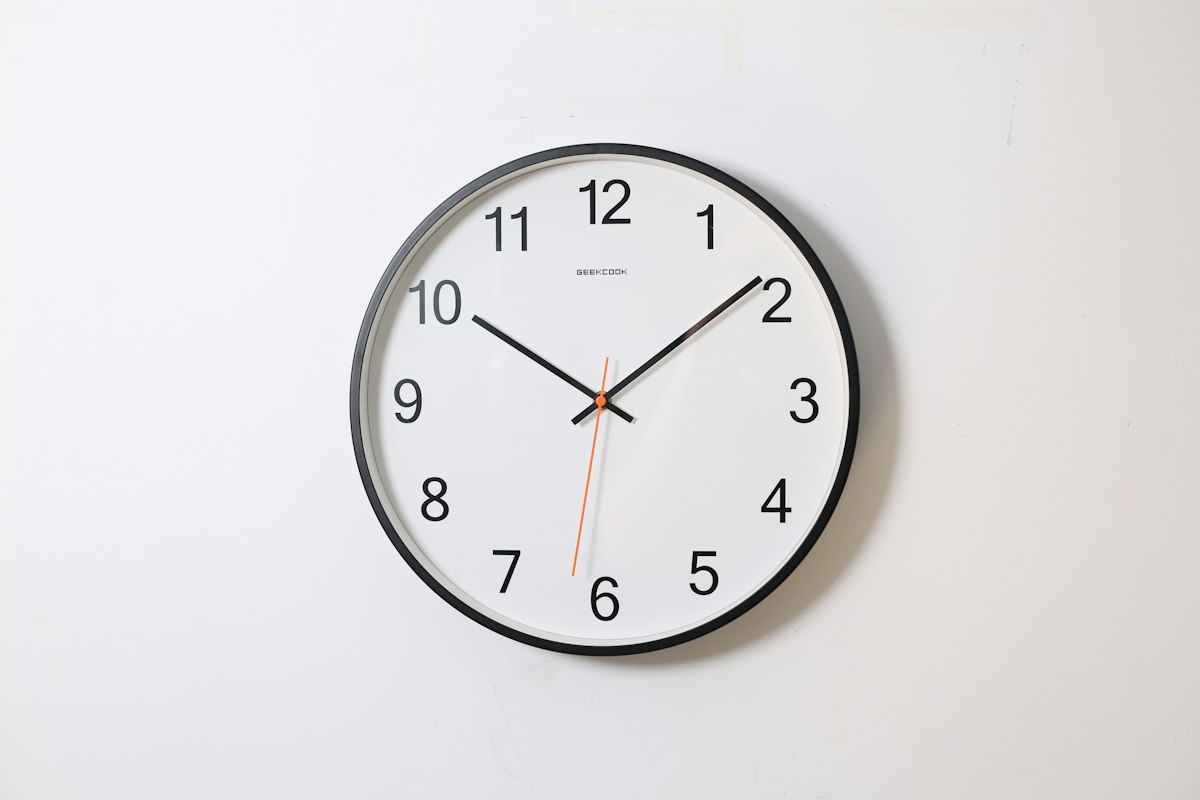 Collection of antique clocks including mantel and wall clocks on display