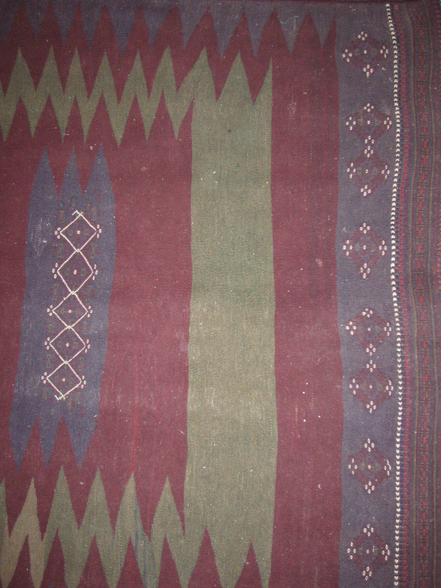 Antique kilim flatweave textile with geometric bands photographed for identification