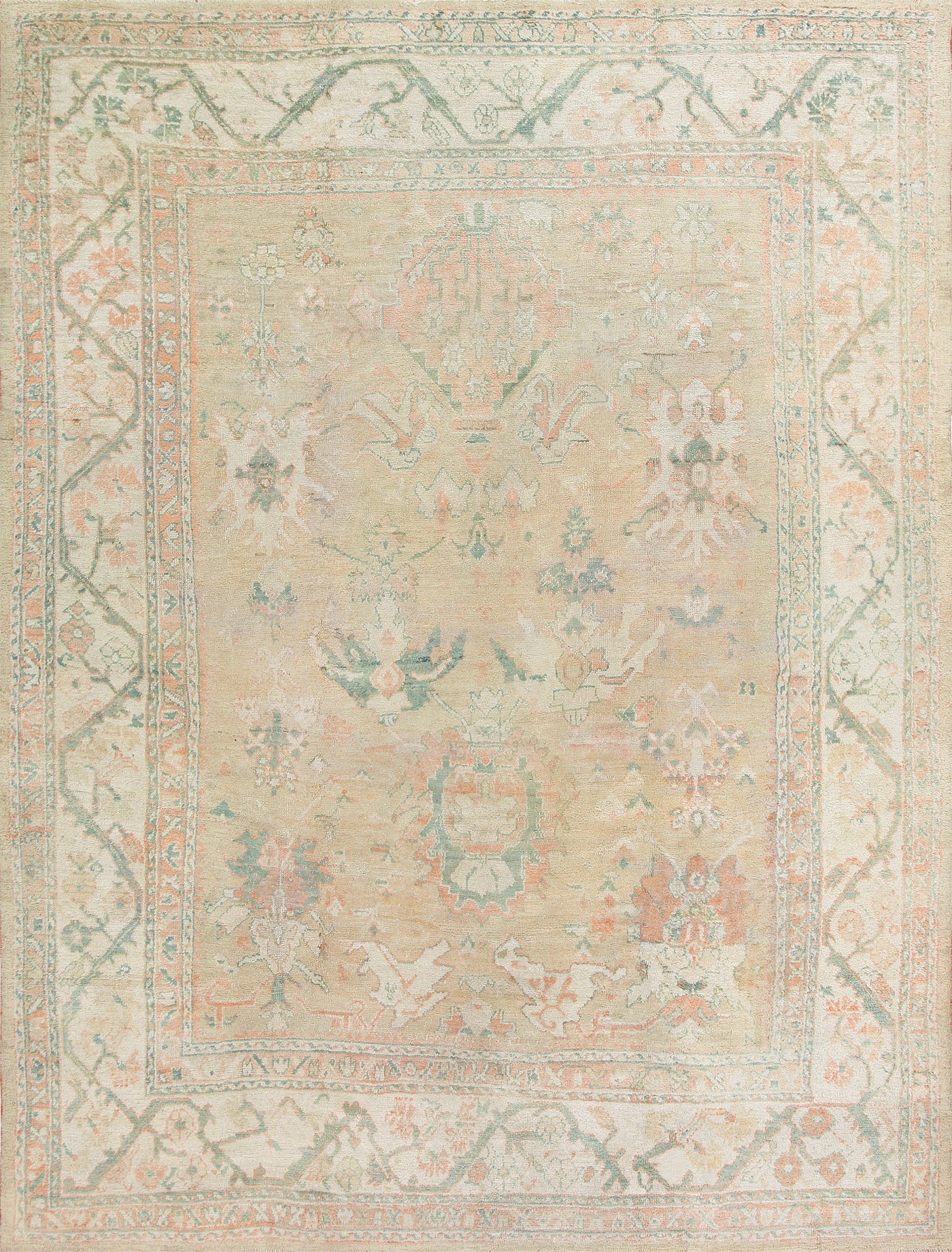 Antique Oushak carpet from Turkey laid out to show full field, borders and scale