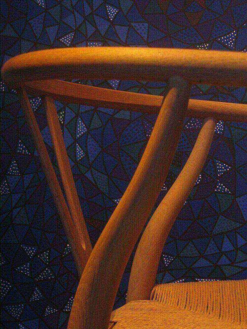 Close-up of a Wegner Wishbone Y-back showing joinery and steam-bent wood