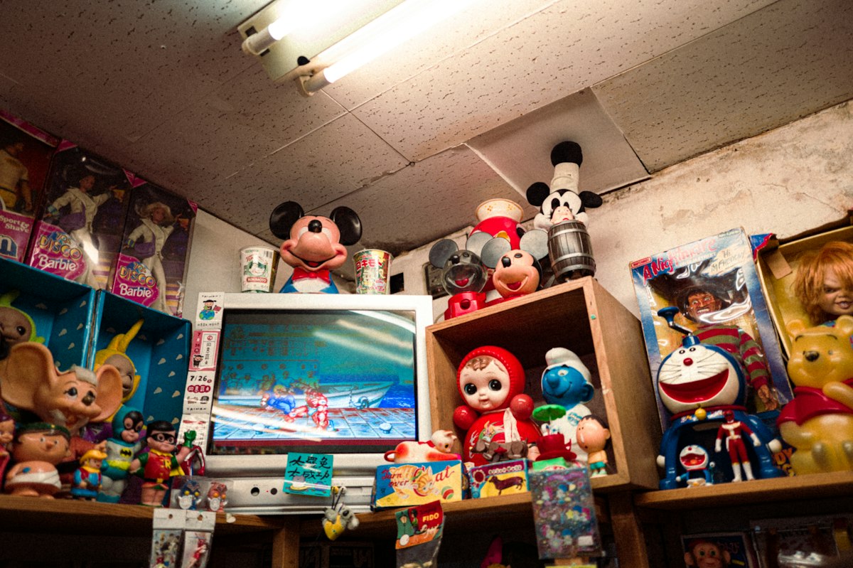 Collection of vintage toys and memorabilia displayed on shelves